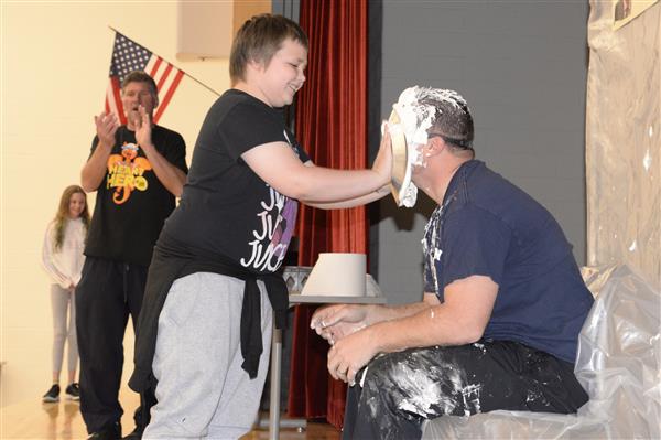 Student Holding a Pie
